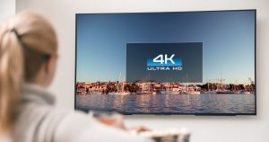Woman watching new 4k TV